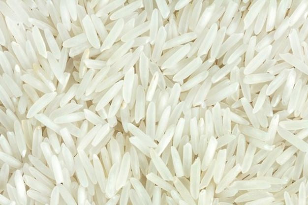 Long grain white rice in a 20 kg bag from Papagino Foods Inc., showing the rice grains in a natural, uncooked state.