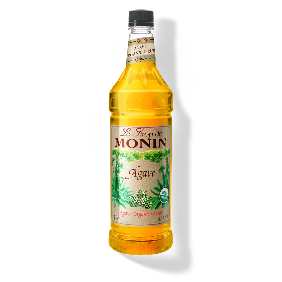 Bottle of Monin Agave Premium Syrup in PET container by Papagino Foods Inc., with clear label showing agave syrup product.