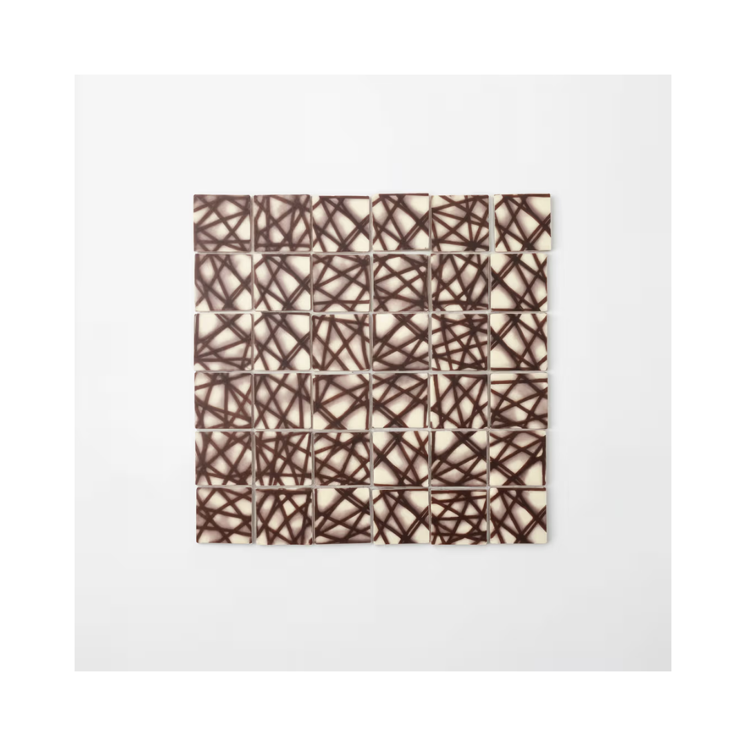 Square patterned chocolate candies from Papagino Foods Inc., 1.2 kg box with 350 pieces, designed with a decorative Barlo pattern.