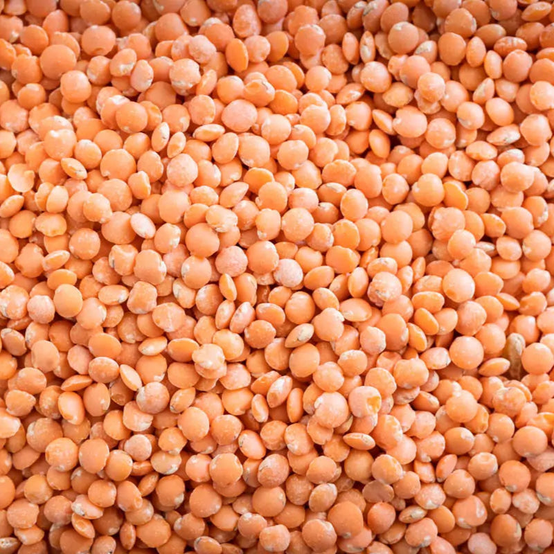 Red slit lentils in a 5 kg bag by Papagino Foods Inc., showcasing bright red lentils ready for cooking or culinary use.