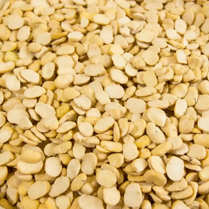 Split fava beans in a 5 kg bag from Papagino Foods Inc., showing the beans' light green color and packaging.
